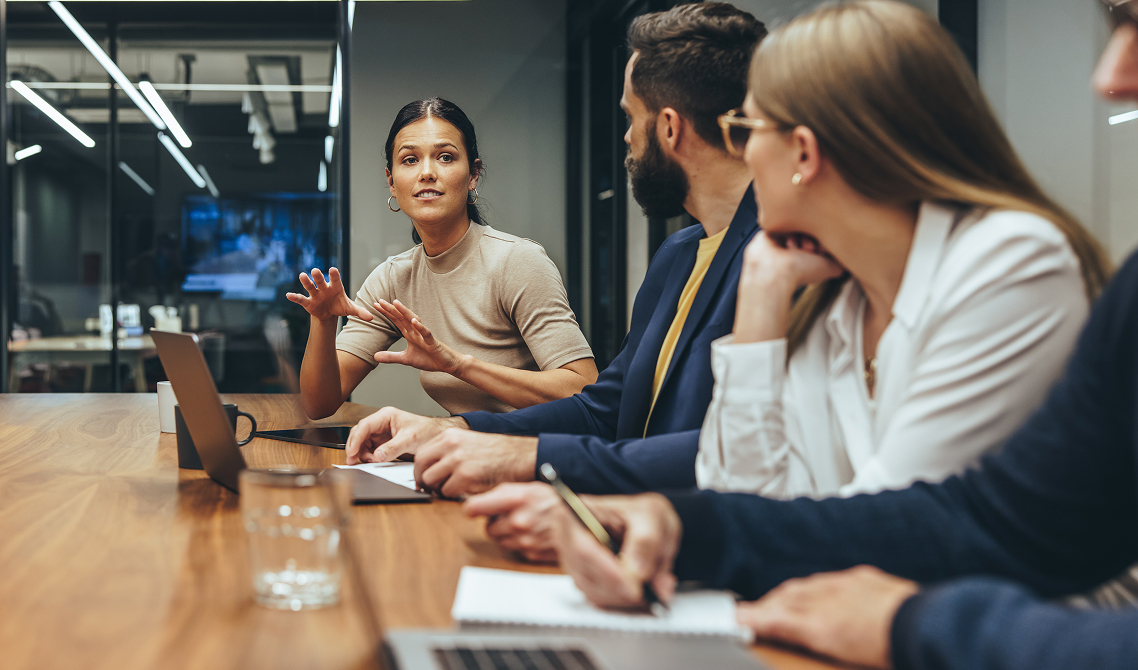 Woman sharing idea with coworkers