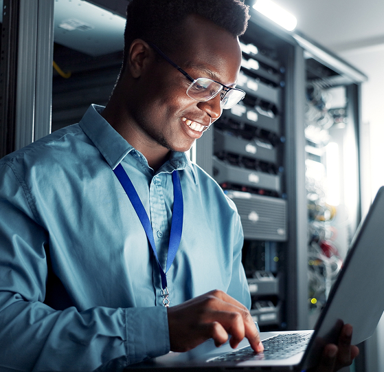 Man smiling working on computer