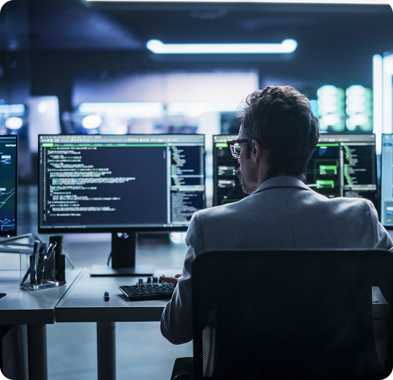 Man working with multiple monitors