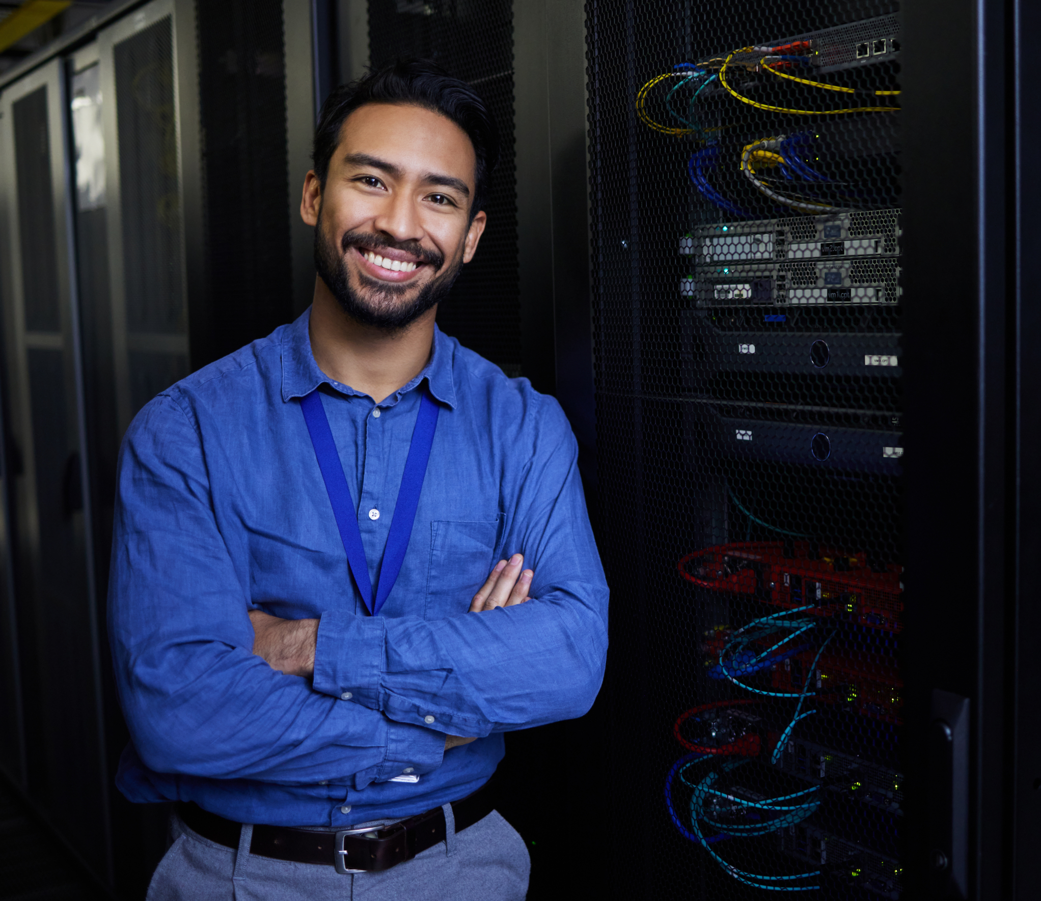 Man in front of server smiling