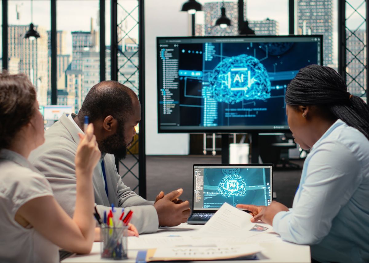 Group looking at computer monitors